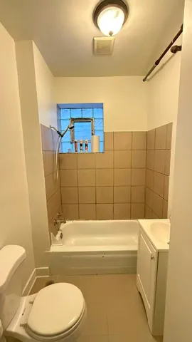 a bathroom with a bathtub and sink