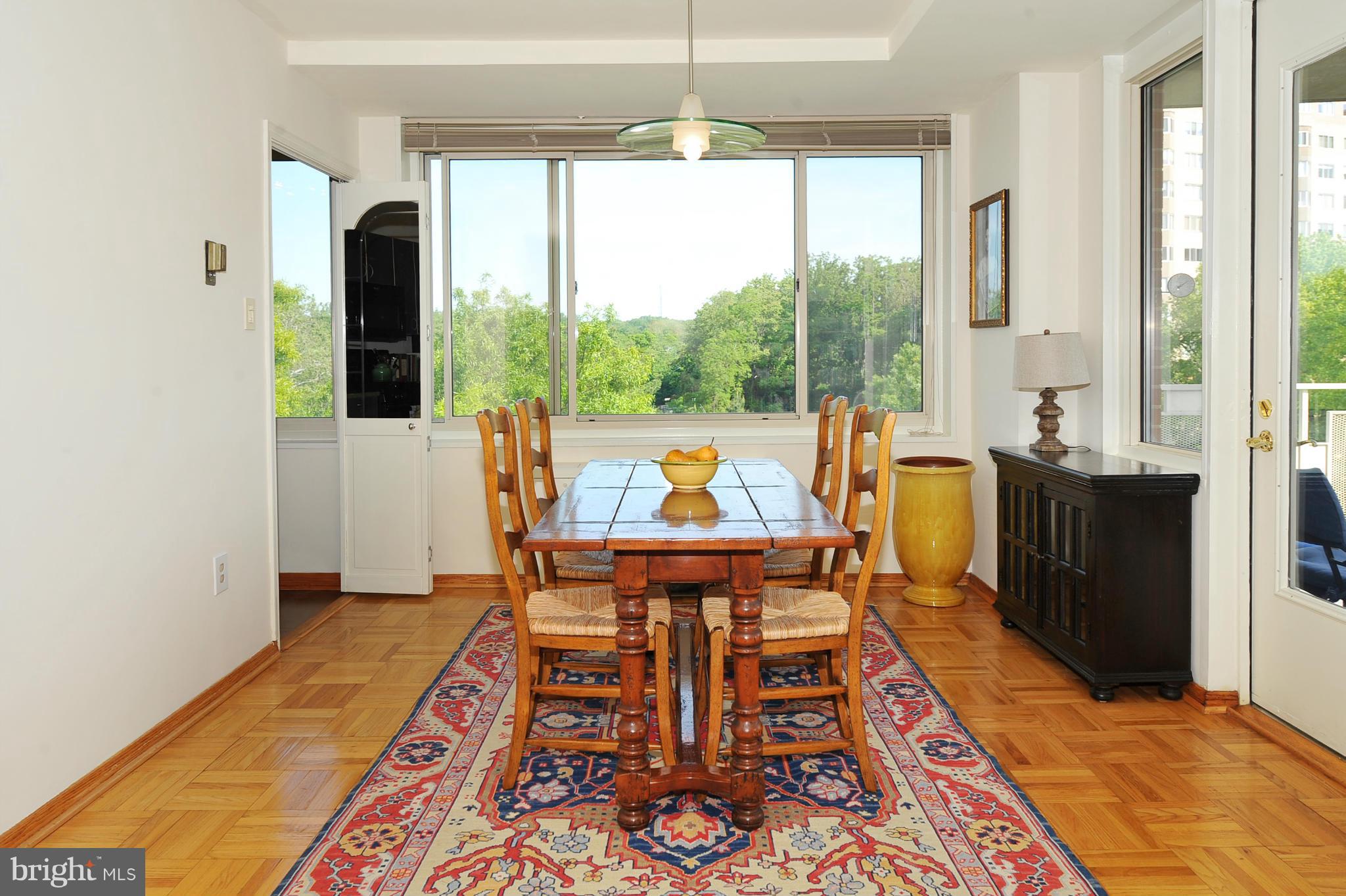 4000 Tunlaw Road Northwest, Unit 1026 Washington, DC 20007 - Photo 2 of 15 a living room with furniture and a table