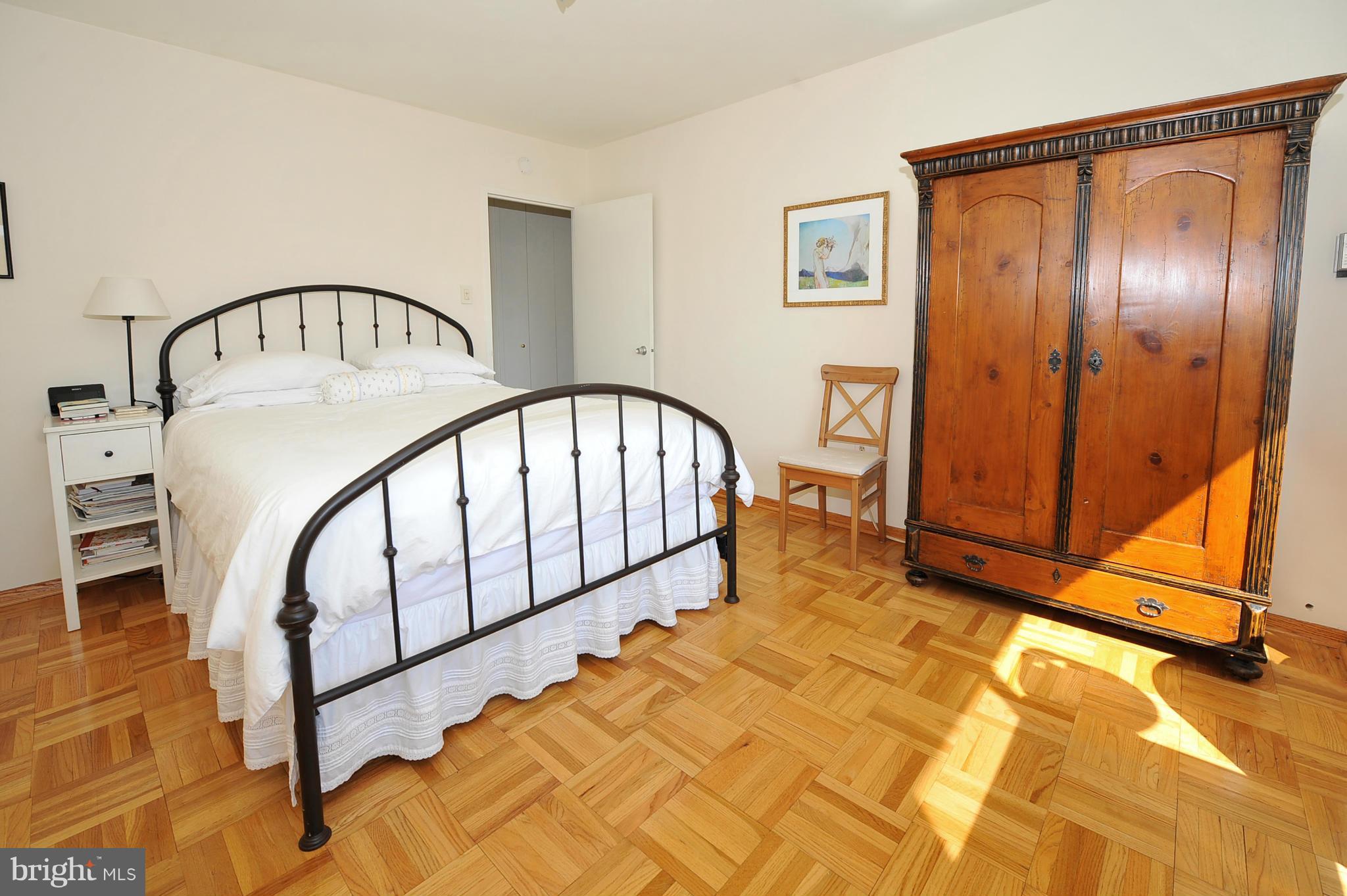 4000 Tunlaw Road Northwest, Unit 1026 Washington, DC 20007 - Photo 12 of 15 a view of a hallway with wooden floor