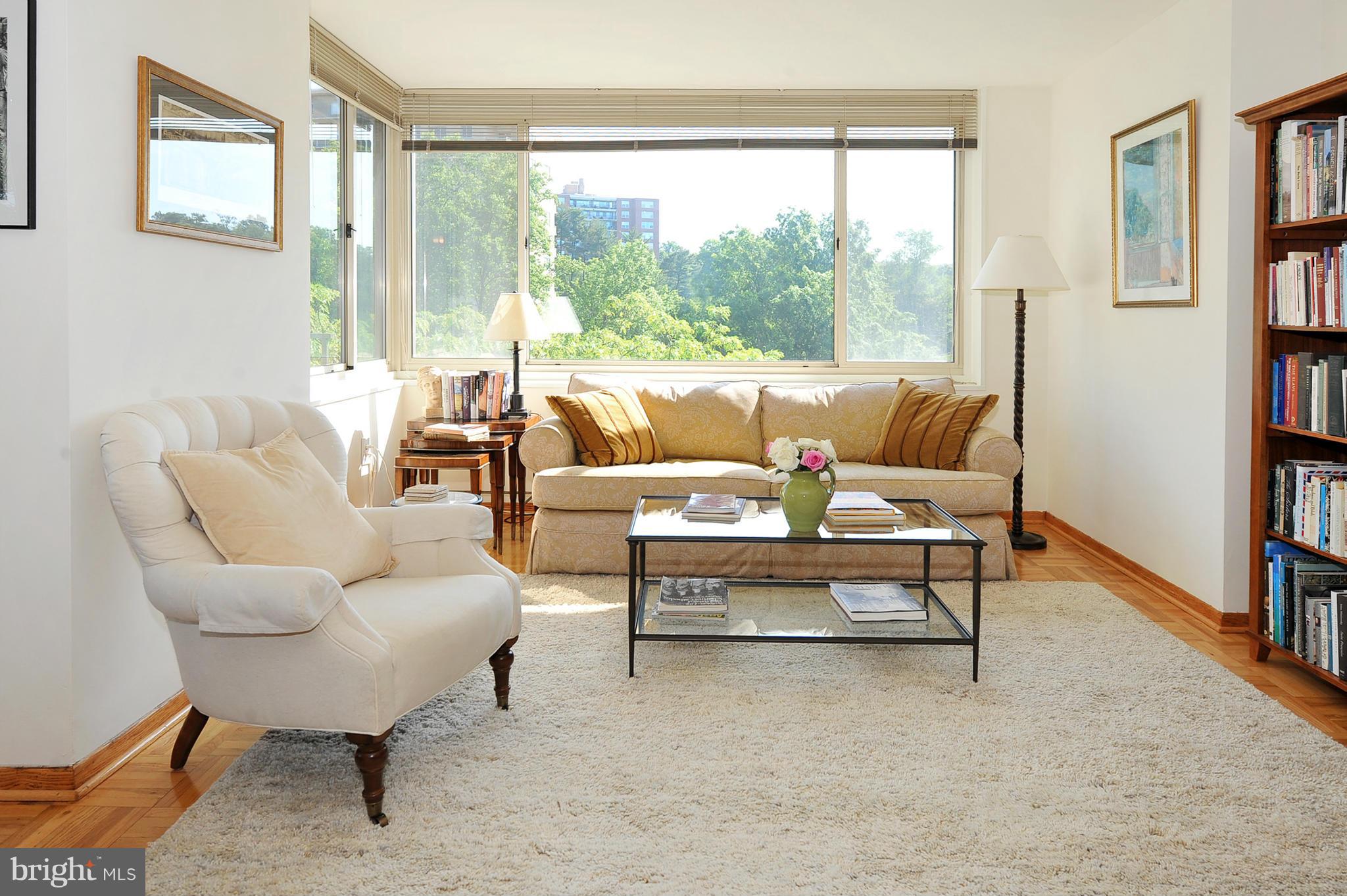 4000 Tunlaw Road Northwest, Unit 1026 Washington, DC 20007 - Photo 4 of 15 a living room with furniture and a large window