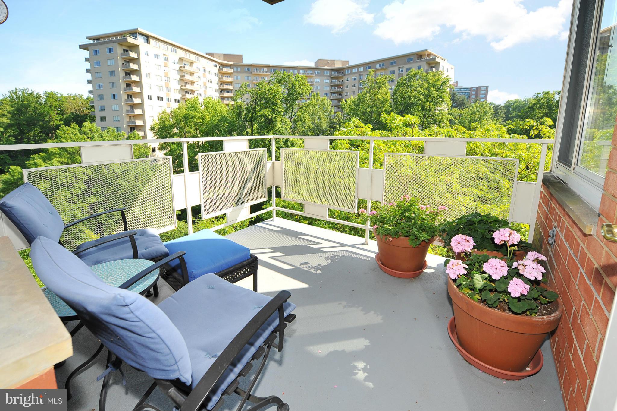 4000 Tunlaw Road Northwest, Unit 1026 Washington, DC 20007 - Photo 8 of 15 a outdoor living space with furniture and garden view