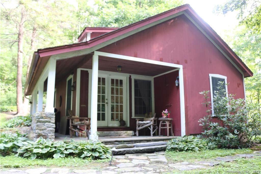 Restricted Address Washington, CT 06777 - Photo 1 of 10 a front view of a house with garden