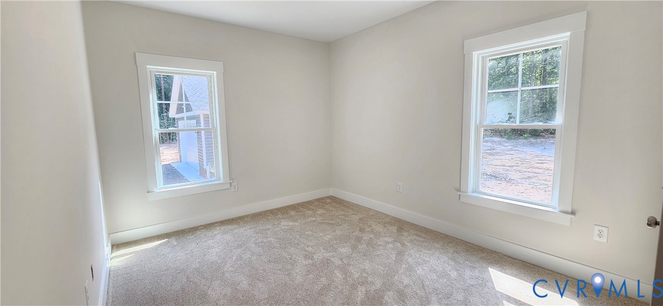 2982 Ashdale Road Center Cross, VA 22437 - Photo 13 of 17 Carpeted room featuring two double-hung windows wi