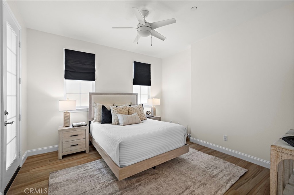 3 Tranquility Place Ladera Ranch, CA 92694 - Photo 32 of 63 a bedroom with a bed a couch and a chandelier