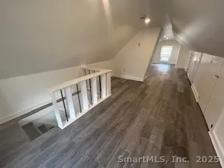 a view of gallery with wooden floor