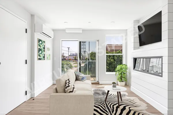 a living room with furniture tv and a flat screen tv