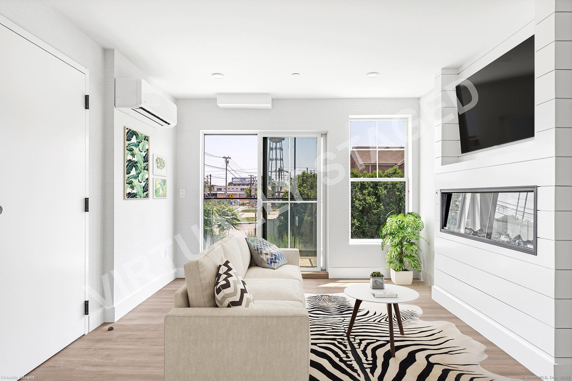 32 Broadway Avenue Stonington, CT 06355 - Photo 17 of 32 a living room with furniture tv and a flat screen tv