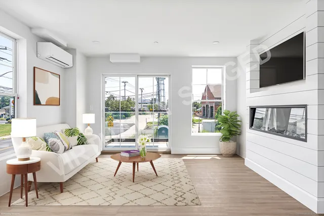 a living room with furniture a flat screen tv and a floor to ceiling window