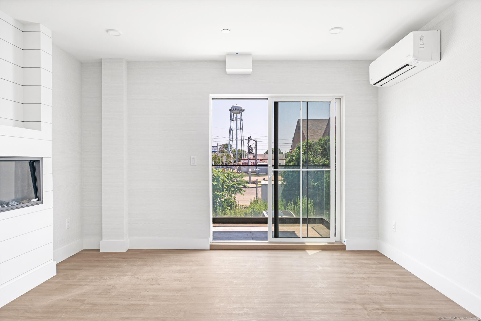 32 Broadway Avenue Stonington, CT 06355 - Photo 23 of 32 a view of an empty room with wooden floor and a window