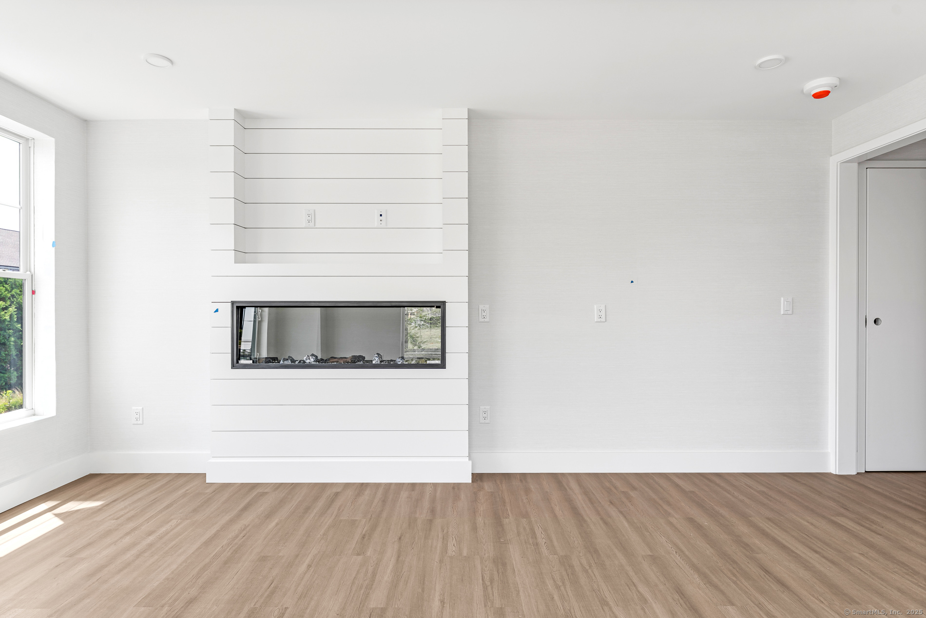 32 Broadway Avenue Stonington, CT 06355 - Photo 25 of 32 a view of a small space with wooden floor and a window