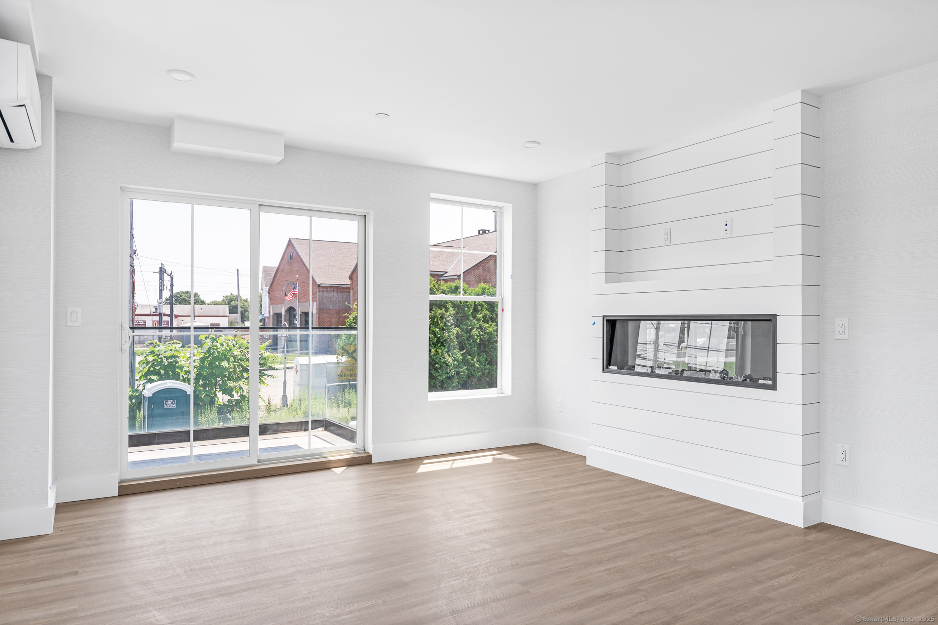 32 Broadway Avenue Stonington, CT 06355 - Photo 28 of 32 an empty room with wooden floor and windows