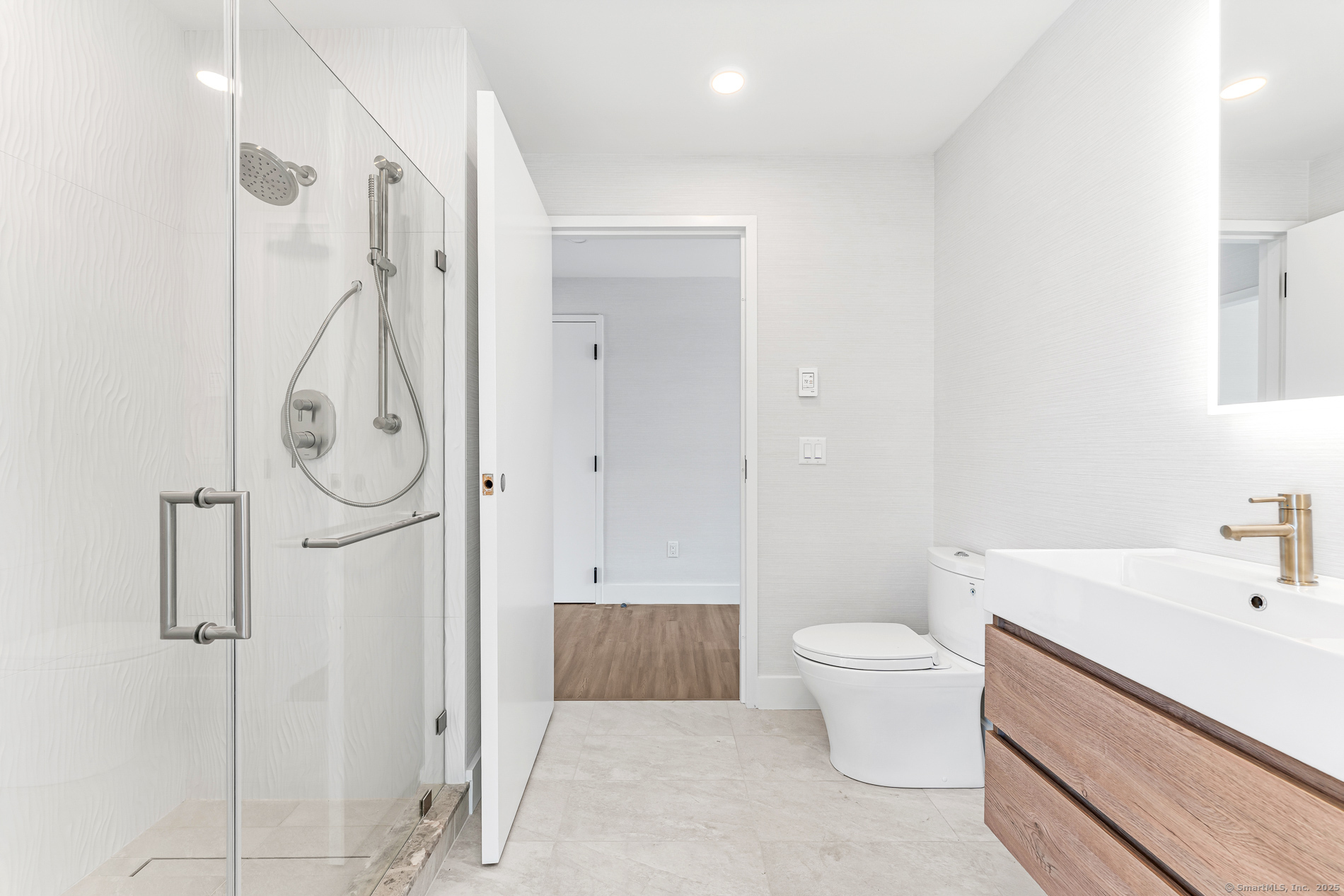 32 Broadway Avenue Stonington, CT 06355 - Photo 30 of 32 a bathroom with a sink a toilet and shower