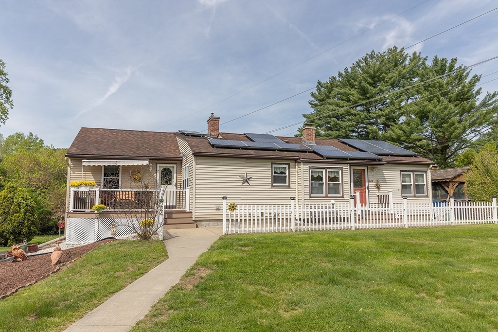224 Palmer Road Monson, MA 01057 - Photo 1 of 40 a front view of a house with a garden