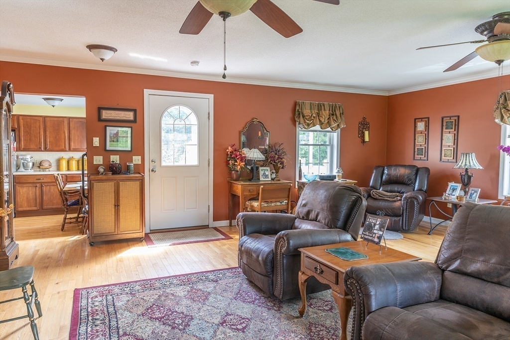 224 Palmer Road Monson, MA 01057 - Photo 11 of 40 a living room with furniture and a chandelier