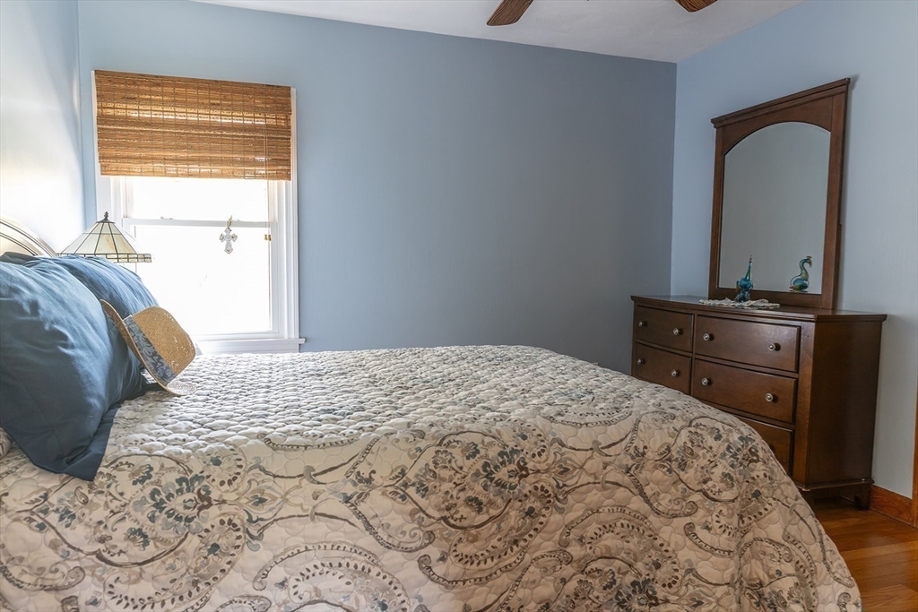 224 Palmer Road Monson, MA 01057 - Photo 15 of 40 a bedroom with a bed and dresser with mirror