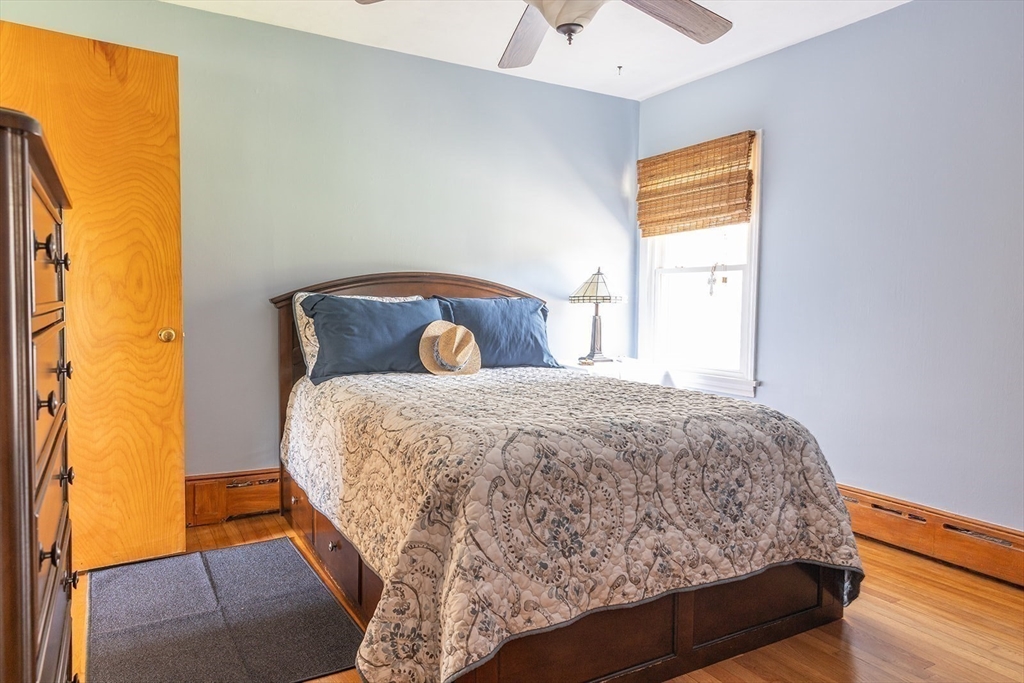 224 Palmer Road Monson, MA 01057 - Photo 16 of 40 a bed sitting in a bedroom next to a window