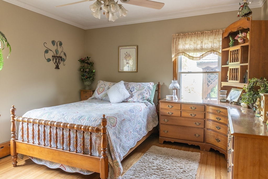 224 Palmer Road Monson, MA 01057 - Photo 19 of 40 a bedroom with a bed and a chandelier