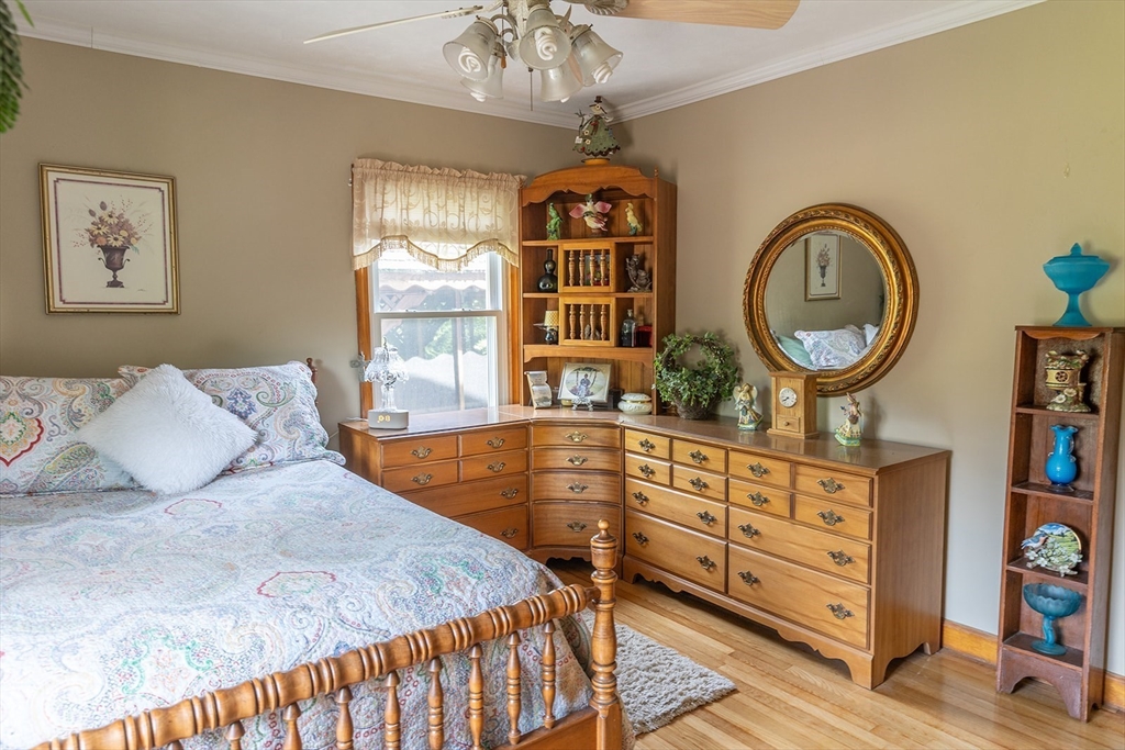 224 Palmer Road Monson, MA 01057 - Photo 20 of 40 a bedroom with a bed a dresser and window