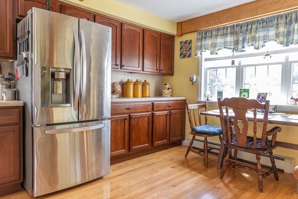 224 Palmer Road Monson, MA 01057 - Photo 2 of 40 a kitchen with stainless steel appliances granite countertop a refrigerator and wooden cabinets
