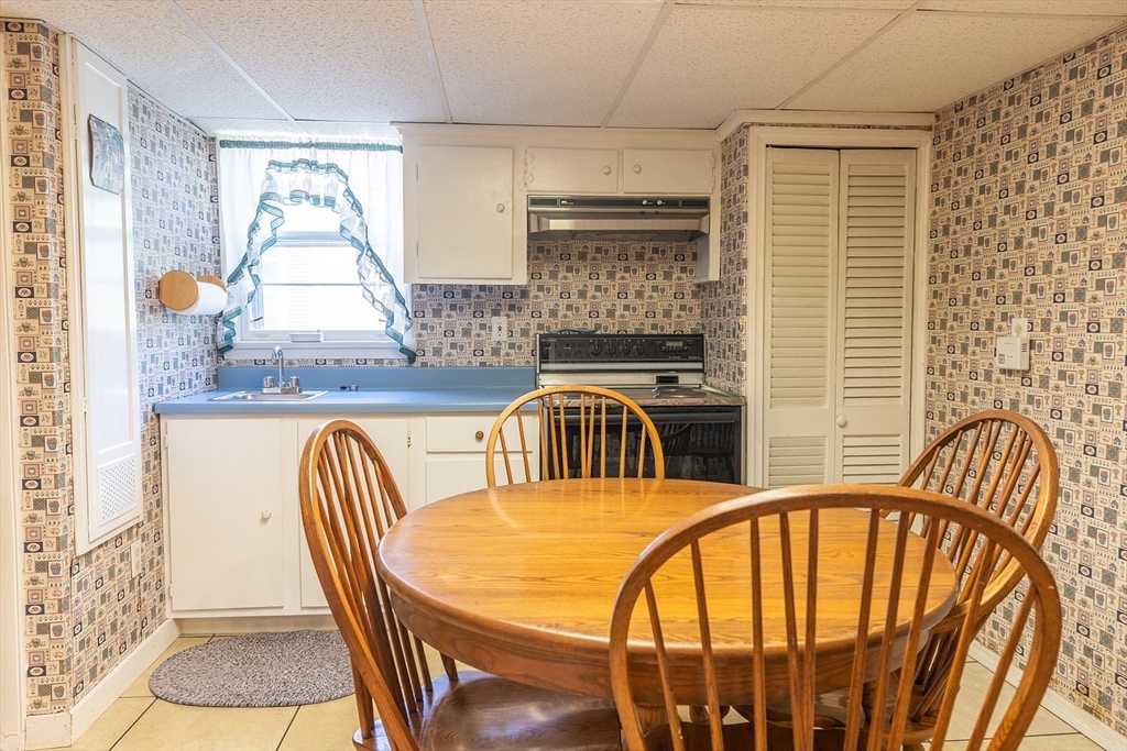 224 Palmer Road Monson, MA 01057 - Photo 22 of 40 a view of a dining room with furniture window and wooden floor