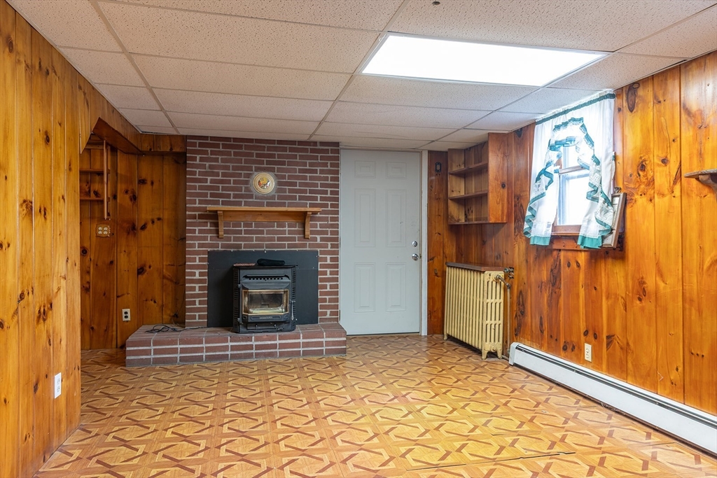 224 Palmer Road Monson, MA 01057 - Photo 25 of 40 a view of a livingroom with a fireplace and window