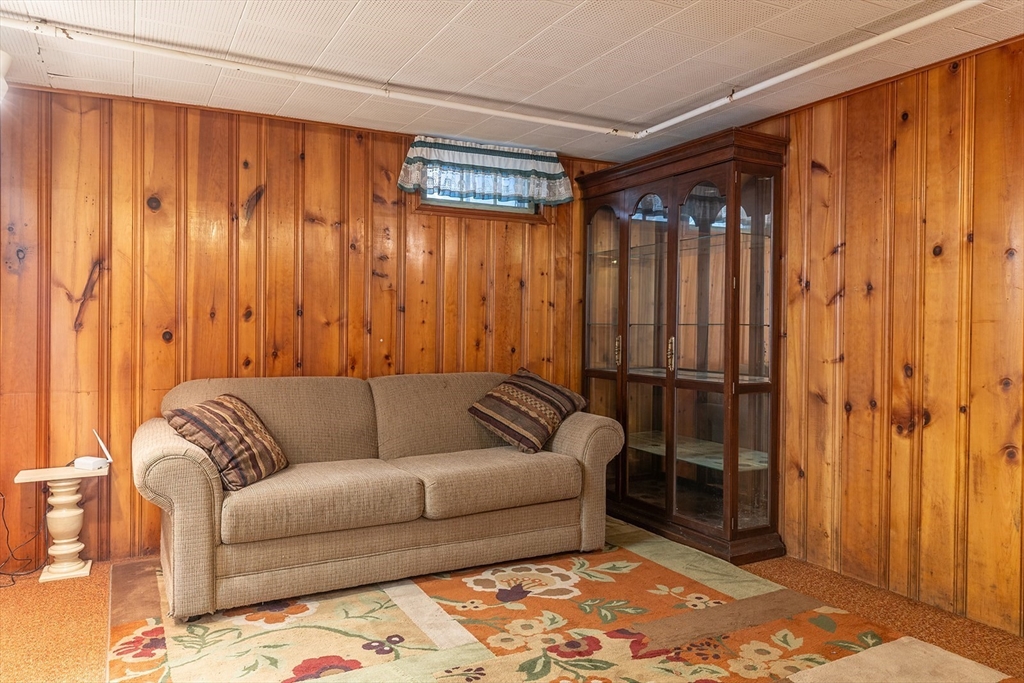 224 Palmer Road Monson, MA 01057 - Photo 28 of 40 a living room with furniture and a rug