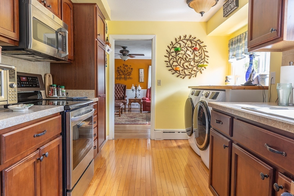 224 Palmer Road Monson, MA 01057 - Photo 3 of 40 a kitchen with stainless steel appliances granite countertop a stove a sink and a refrigerator