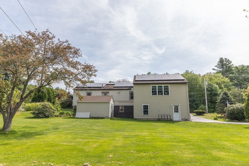224 Palmer Road Monson, MA 01057 - Photo 32 of 40 a view of a house with a yard and sitting area