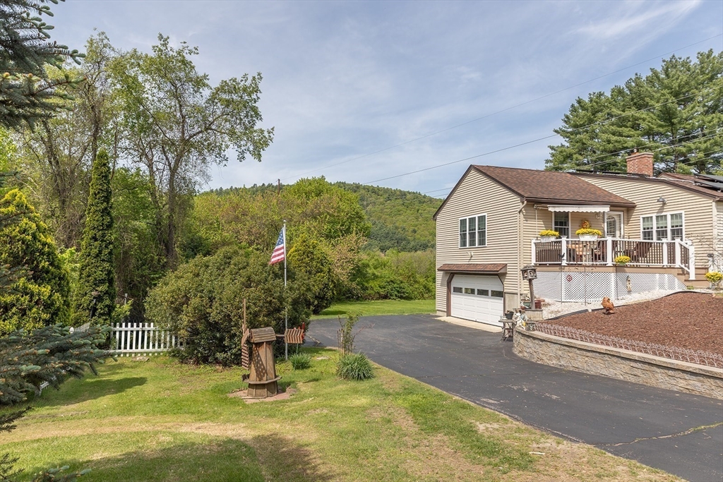 224 Palmer Road Monson, MA 01057 - Photo 37 of 40 a view of a house with backyard porch and sitting area