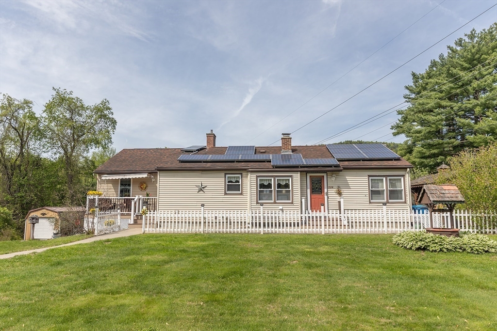 224 Palmer Road Monson, MA 01057 - Photo 38 of 40 a view of a house with a backyard