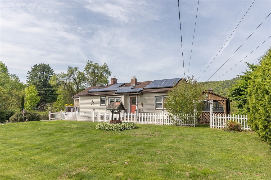 224 Palmer Road Monson, MA 01057 - Photo 40 of 40 a front view of house with yard and green space