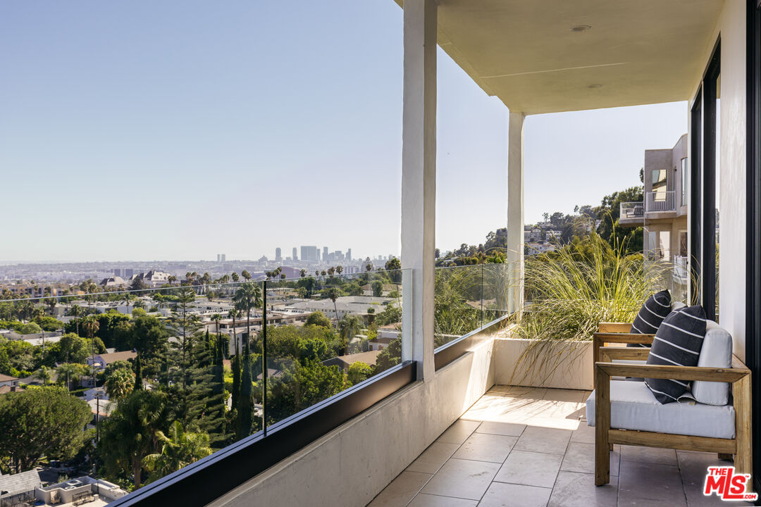 7866 Fareholm Drive Los Angeles, CA 90046 - Photo 12 of 27 a view of a city from a balcony