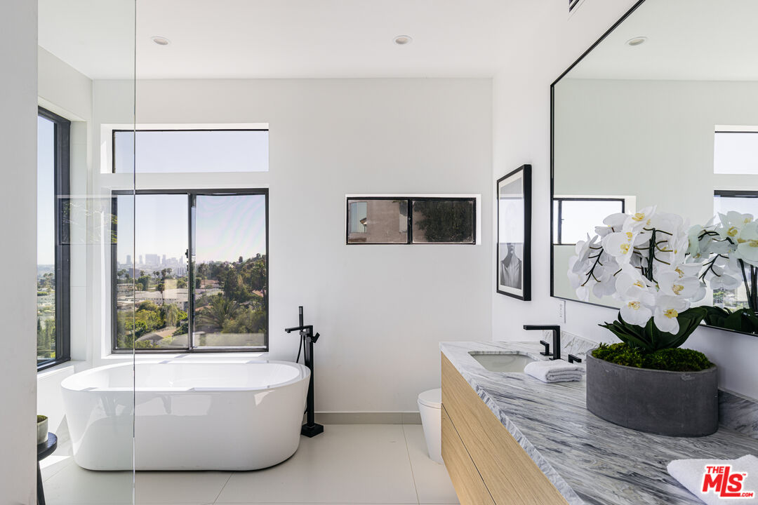 7866 Fareholm Drive Los Angeles, CA 90046 - Photo 13 of 27 a living room with furniture and a potted plant
