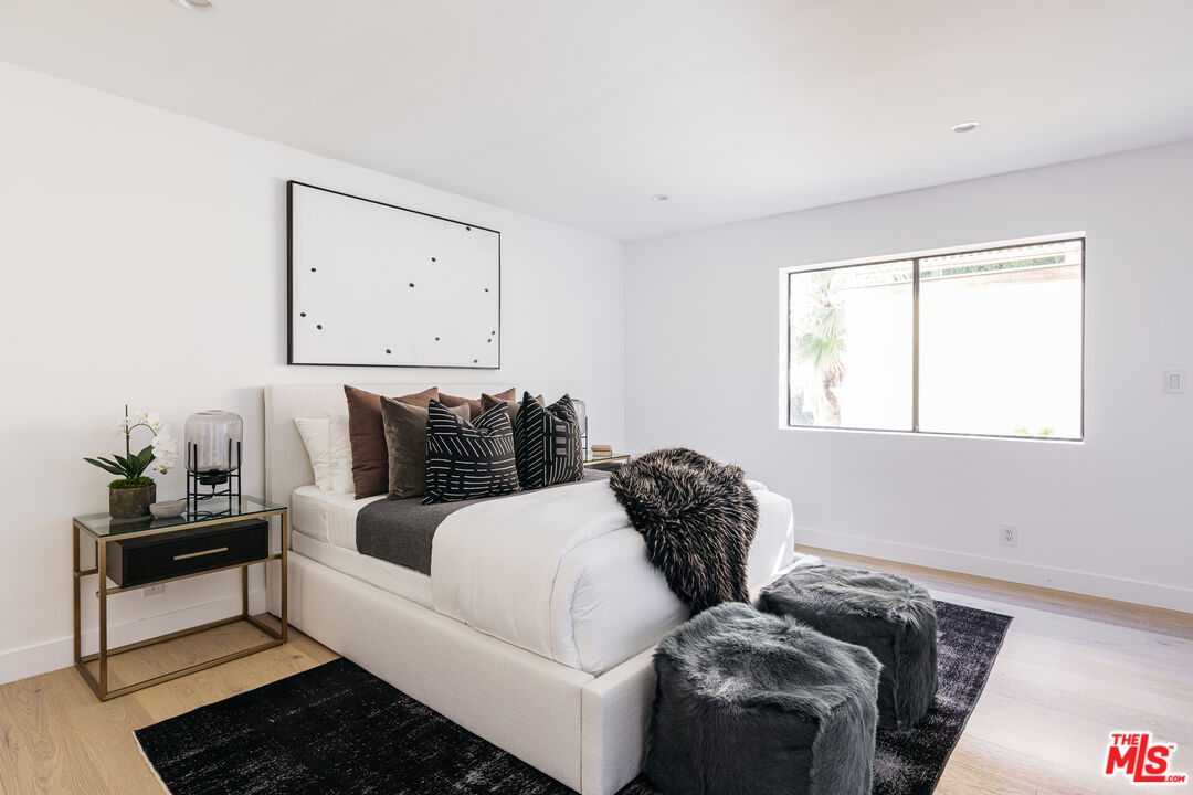 7866 Fareholm Drive Los Angeles, CA 90046 - Photo 16 of 27 a living room with furniture and a window