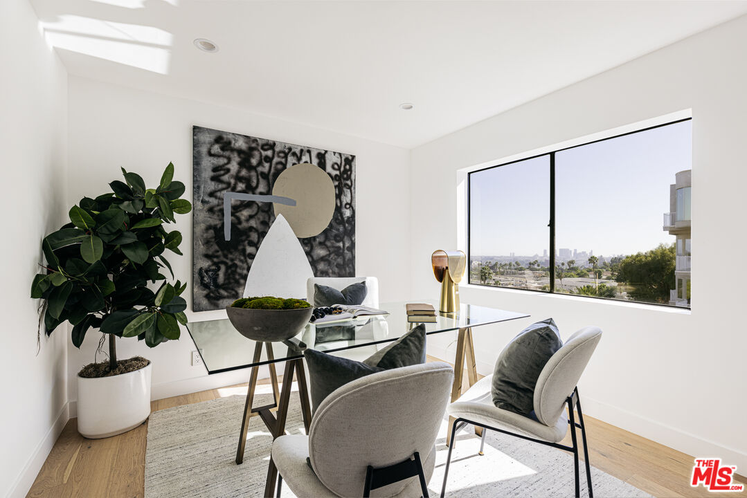 7866 Fareholm Drive Los Angeles, CA 90046 - Photo 18 of 27 a living room with furniture and a potted plant