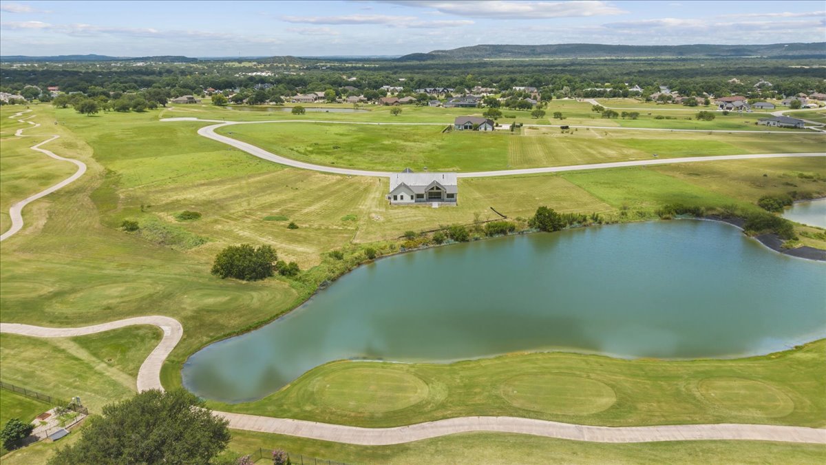224 Sandia Loop Kingsland, TX 78639 - Photo 29 of 32 a view of a swimming pool and a lake