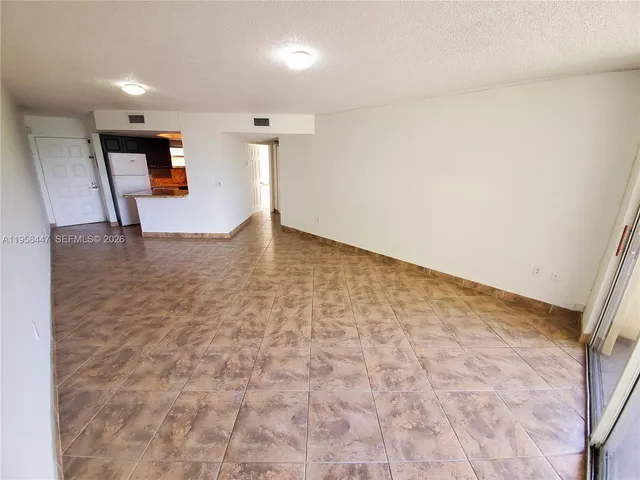 a view of a livingroom with wooden floor