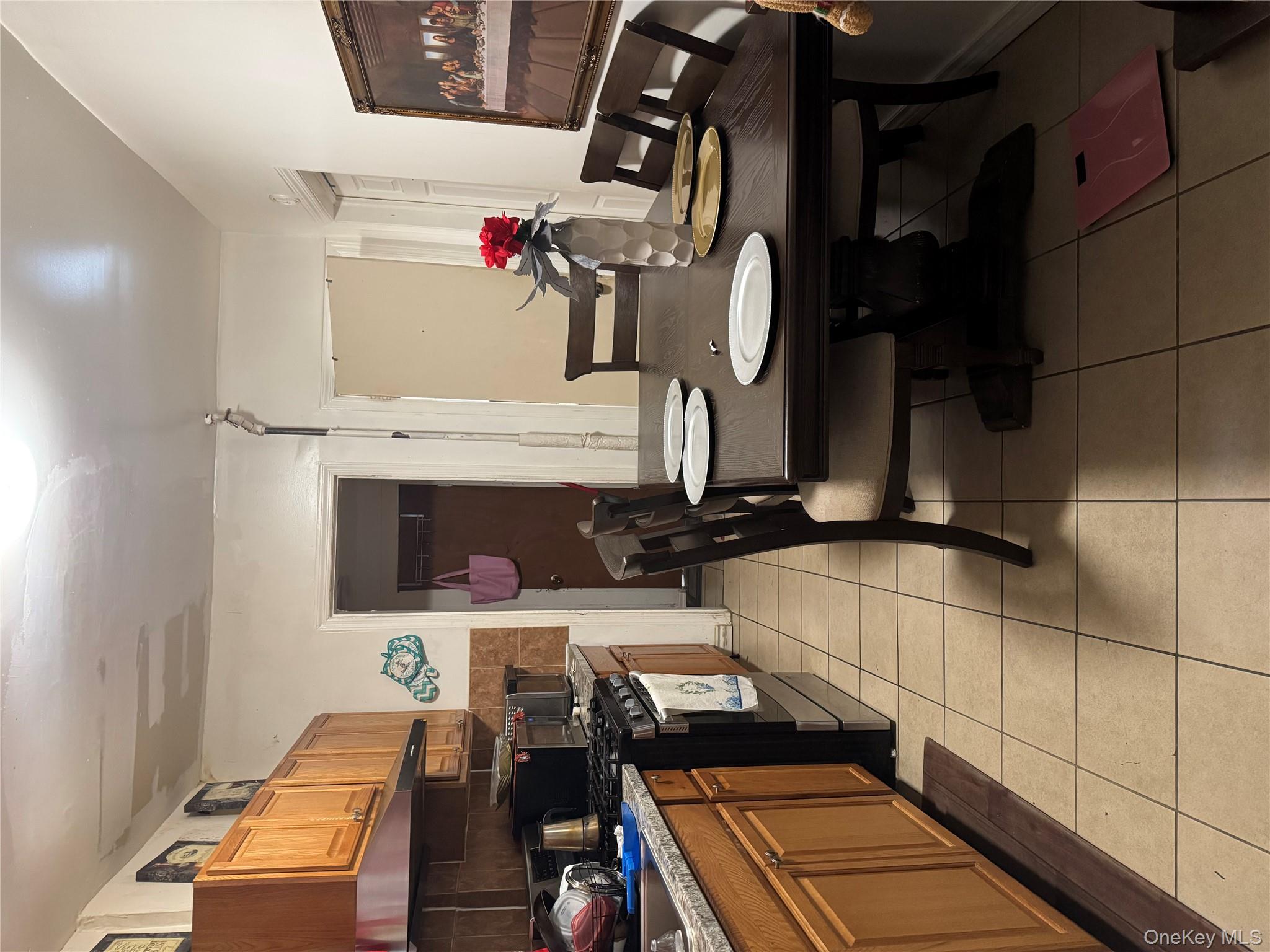 94-13 116th Street Queens, NY 11419 - Photo 13 of 34 Dining room with light tile patterned floors
