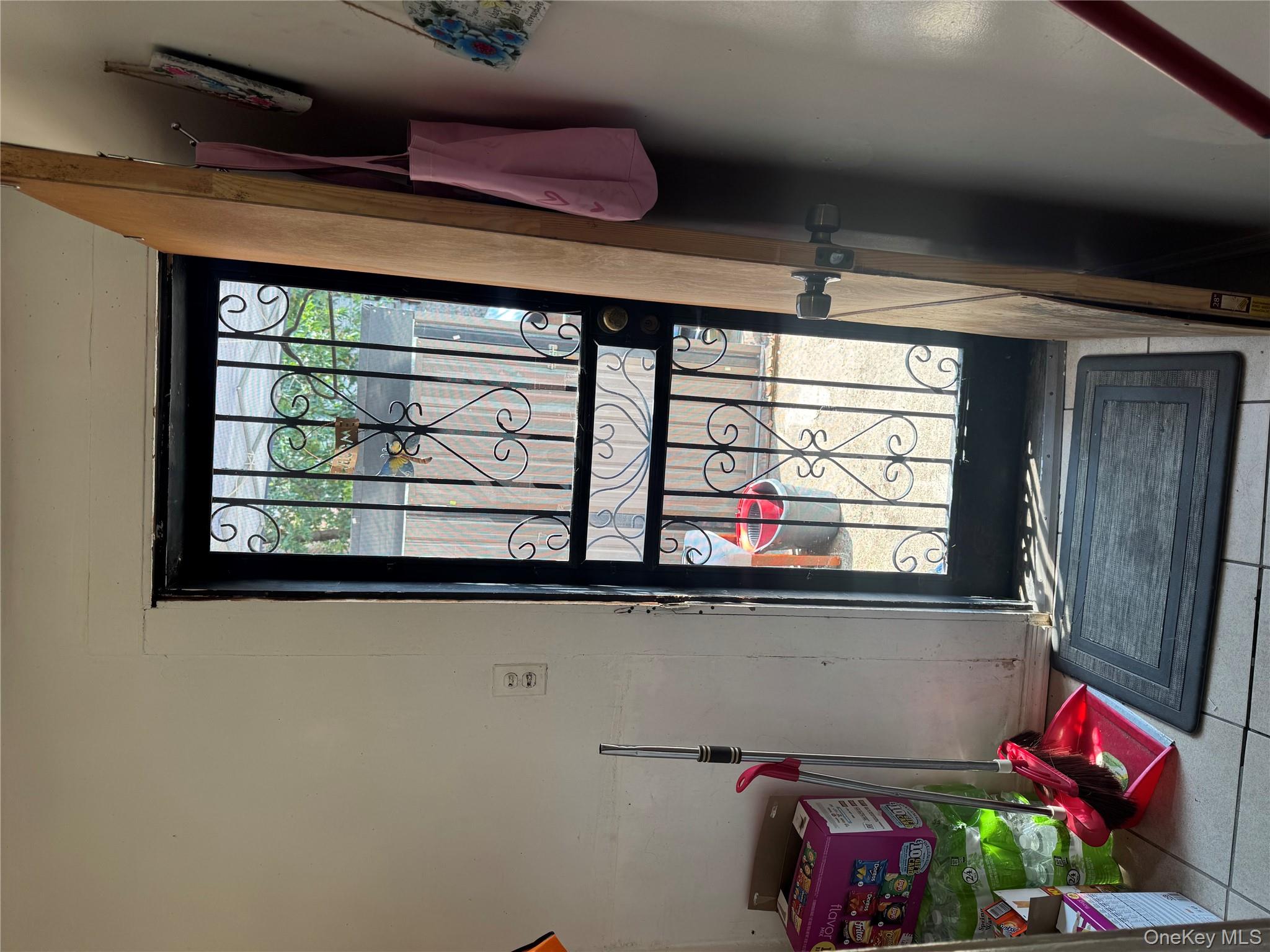 94-13 116th Street Queens, NY 11419 - Photo 15 of 34 Doorway to outside with tile patterned floors