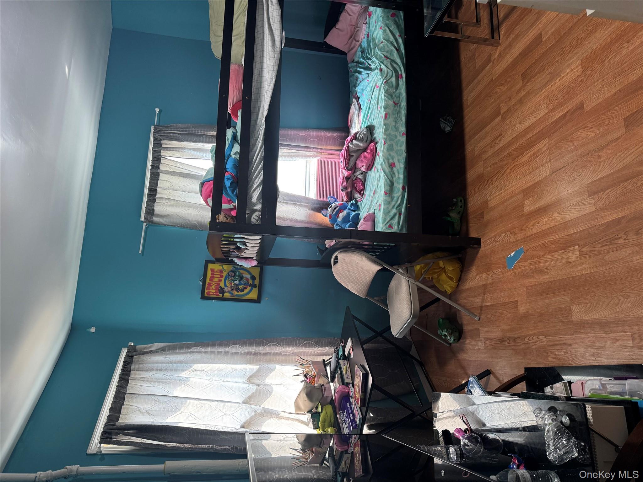 94-13 116th Street Queens, NY 11419 - Photo 19 of 34 Bedroom featuring wood finished floors