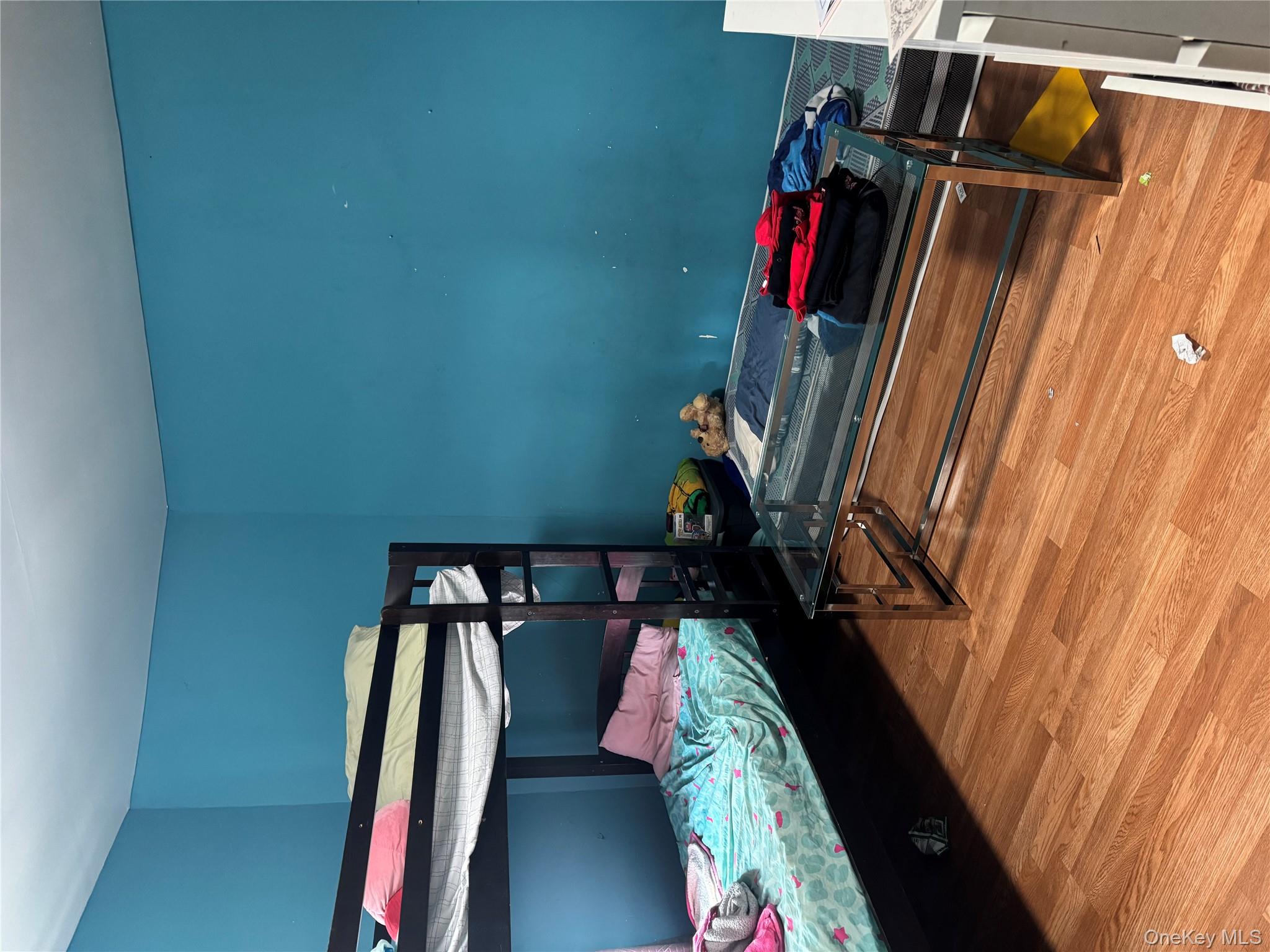 94-13 116th Street Queens, NY 11419 - Photo 20 of 34 Bedroom with light wood-style floors