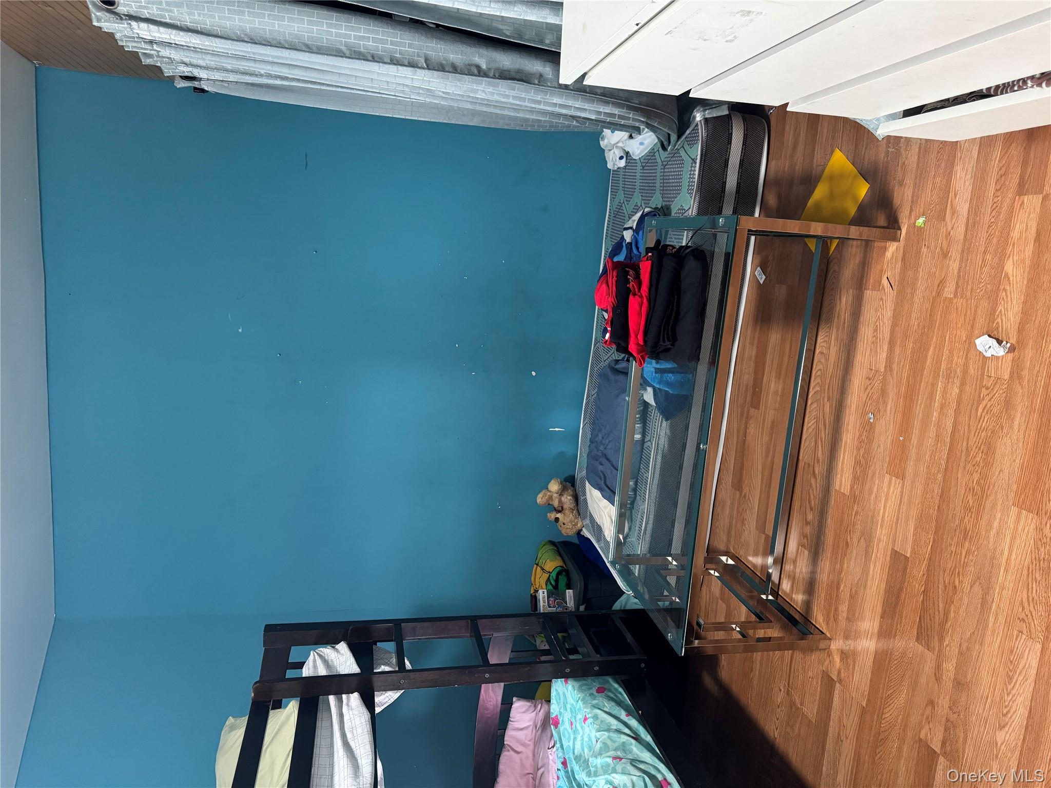 94-13 116th Street Queens, NY 11419 - Photo 21 of 34 Bedroom with light wood finished floors