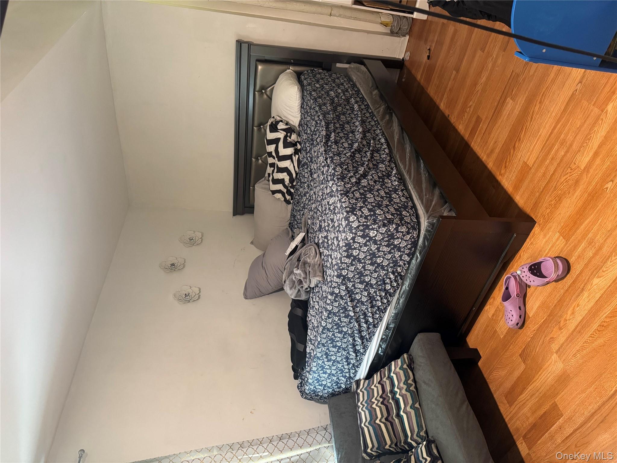 94-13 116th Street Queens, NY 11419 - Photo 23 of 34 Bedroom with light wood-style floors