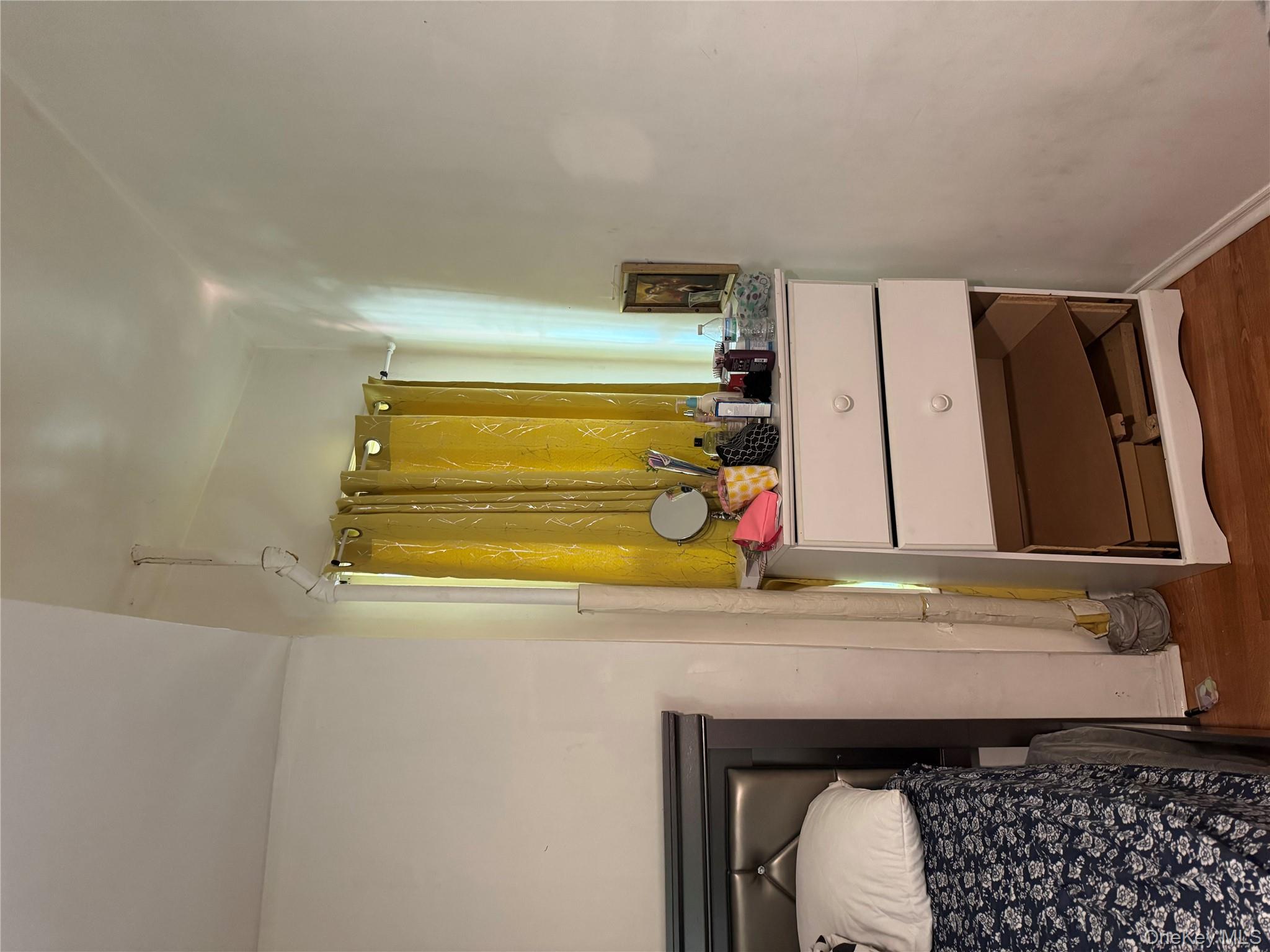 94-13 116th Street Queens, NY 11419 - Photo 24 of 34 Bedroom featuring wood finished floors