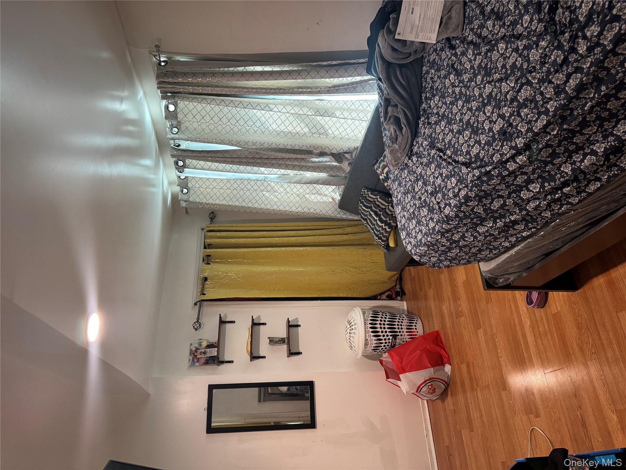 94-13 116th Street Queens, NY 11419 - Photo 25 of 34 Bedroom featuring light wood-type flooring