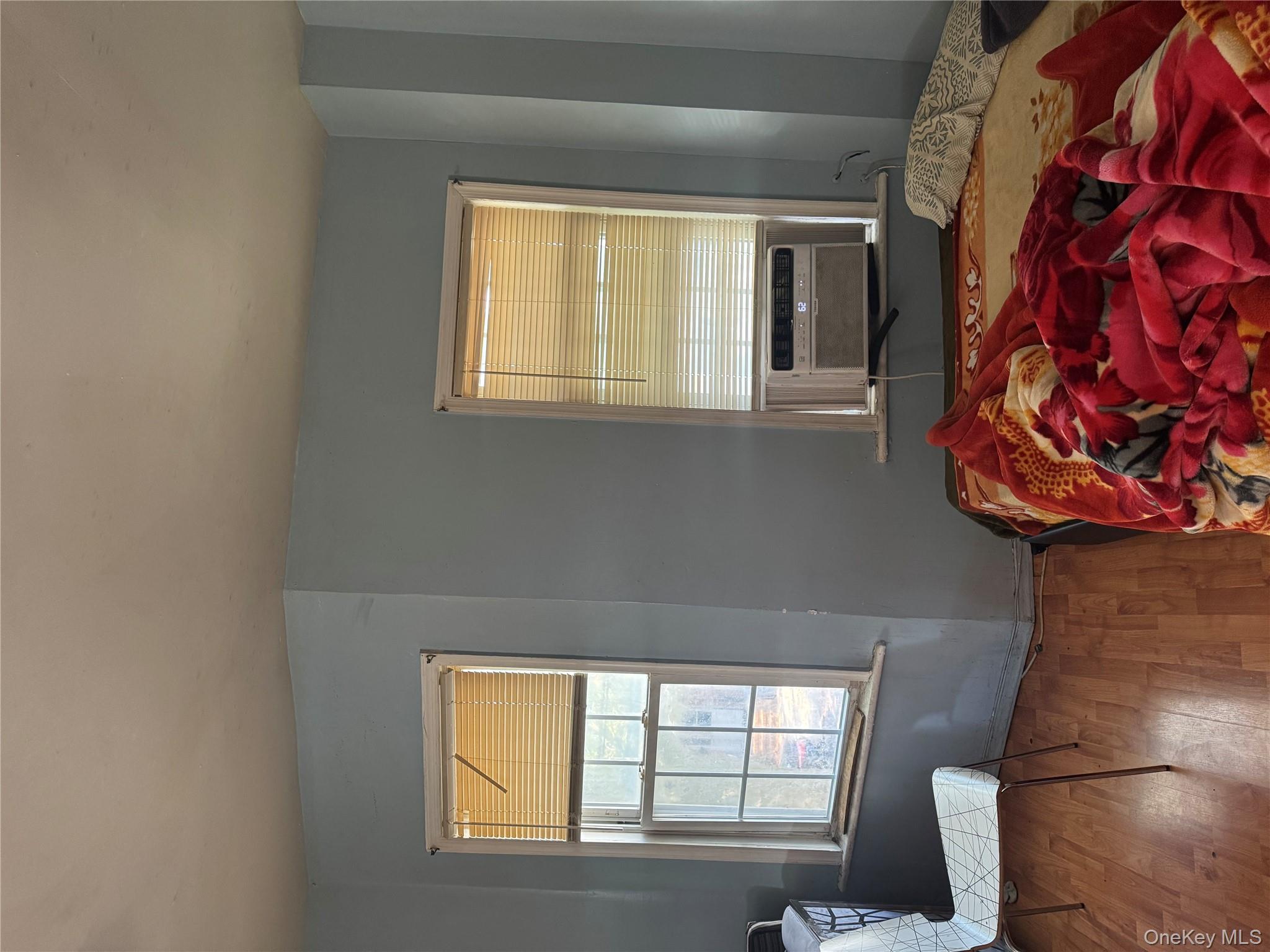 94-13 116th Street Queens, NY 11419 - Photo 30 of 34 Bedroom featuring wood finished floors