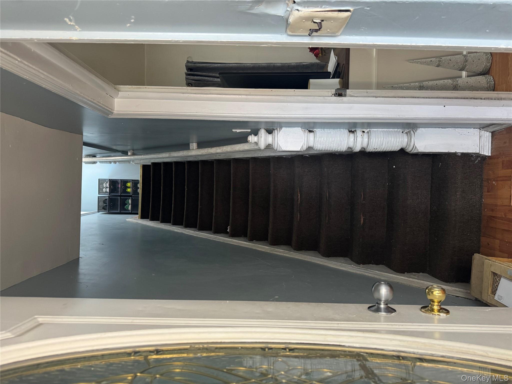 94-13 116th Street Queens, NY 11419 - Photo 10 of 34 Staircase featuring wood finished floors