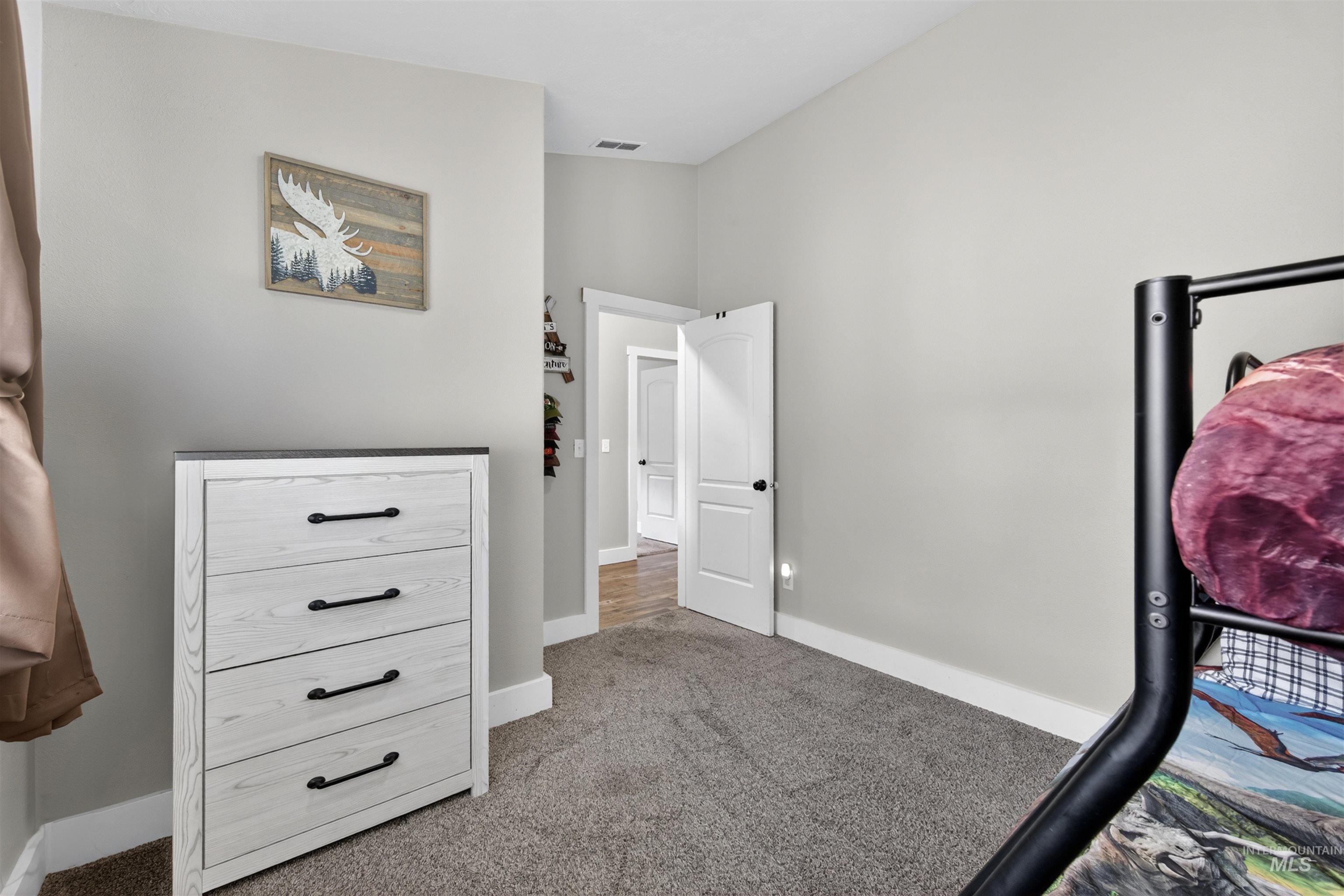 4 Round Up Circle Boise, ID 83716 - Photo 28 of 47 Carpeted room with light gray walls and white trim