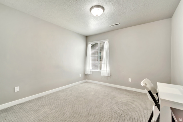 3232 West 1670th Street North Provo, UT 84601 - Photo 21 of 33 Unfurnished office featuring a textured ceiling and carpet floors