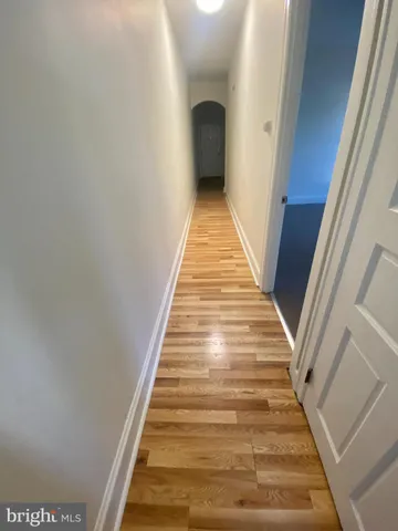 a view of a livingroom with a ceiling fan and window